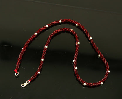 Elegant handmade galaxy necklace by TRIBAL ORNAMENTS featuring silver and semi-precious beads on a triple chain.