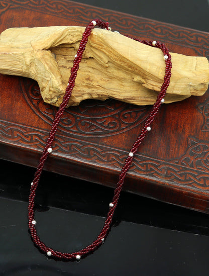 Elegant handmade galaxy necklace by TRIBAL ORNAMENTS featuring silver and semi-precious beads on a triple chain set.