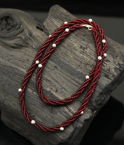 Elegant handmade galaxy necklace by TRIBAL ORNAMENTS with silver and semi-precious beads on a triple chain, crafted in 925 sterling silver.