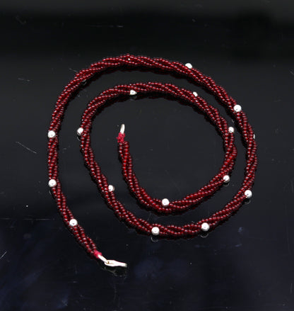 Elegant handmade galaxy necklace by TRIBAL ORNAMENTS featuring silver and semi-precious beads on a triple chain, crafted in 925 silver.