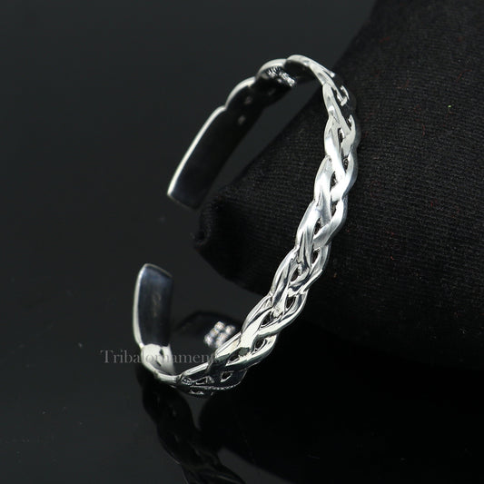 Elegant 925 sterling silver adjustable cuff bangle bracelet by TRIBAL ORNAMENTS, featuring a stylish unisex design with intricate details.
