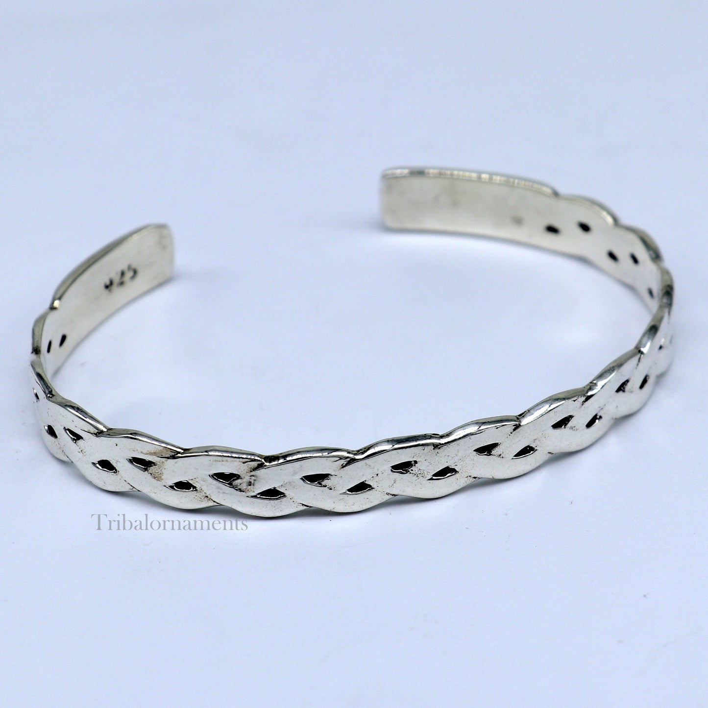 Elegant 925 sterling silver adjustable cuff bangle bracelet by TRIBAL ORNAMENTS, featuring a stylish unisex design with intricate detailing.