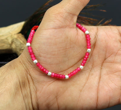 Elegant tribal threads anklet with semi-precious ruby stones and 925 silver beads, custom-made beaded jewelry for ankle adornment.