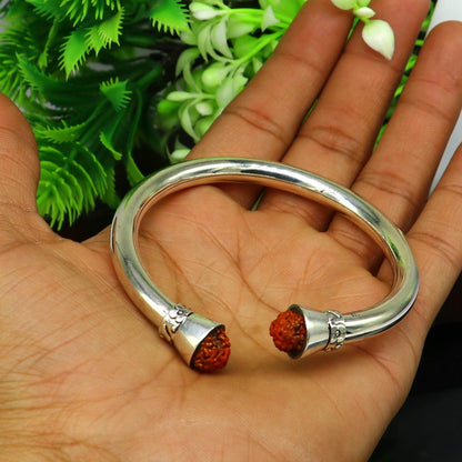 Elegant 925 sterling silver Rudraksha bangle cuff bracelet, shiny, handmade tribal jewelry for gifting or stylish wear.