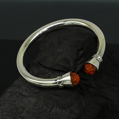 Sterling silver Rudraksha bangle cuff bracelet by Tribal Ornaments, shiny and handmade, elegant tribal jewelry for gifting.