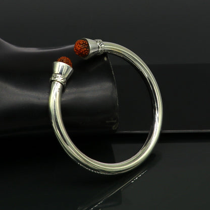Shiny 925 sterling silver Rudraksha bangle cuff bracelet by TRIBAL ORNAMENTS, featuring a plain, elegant tribal design.
