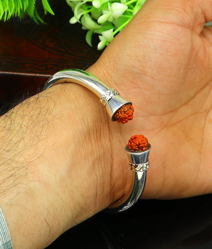 Sterling silver Rudraksha bangle cuff bracelet from TRIBAL ORNAMENTS, featuring a shiny, plain, stylish tribal design.