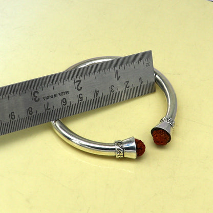925 sterling silver Rudraksha bangle cuff bracelet by TRIBAL ORNAMENTS, featuring a shiny, plain, stylish tribal design.