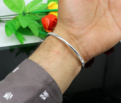 Sterling silver round bangle bracelet with shiny finish, stylish tribal design, ideal for brides and belly dance jewelry.