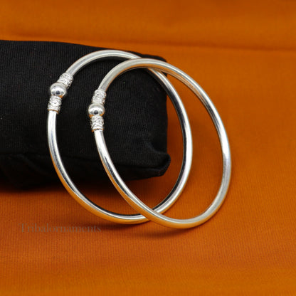 Sterling silver round bangle bracelet with a shiny, sleek finish, ideal for brides and belly dance jewelry.