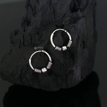 Small 925 sterling silver handmade hoops earrings by TRIBAL ORNAMENTS, featuring tribal Bali-inspired design and intricate craftsmanship.