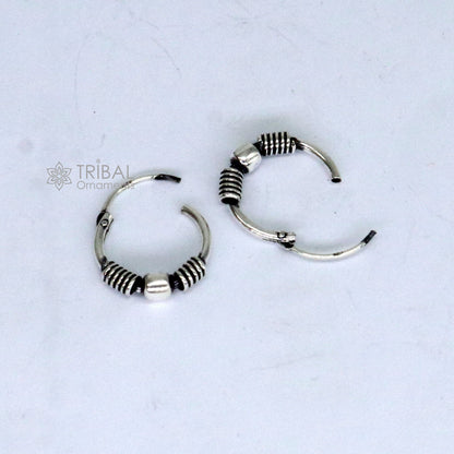 Sterling silver handmade small hoop earrings from Bali, stylish tribal jewelry by TRIBAL ORNAMENTS.
