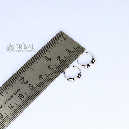 Sterling silver handmade hoop earrings by TRIBAL ORNAMENTS, stylish small Bali tribal jewelry with intricate design.
