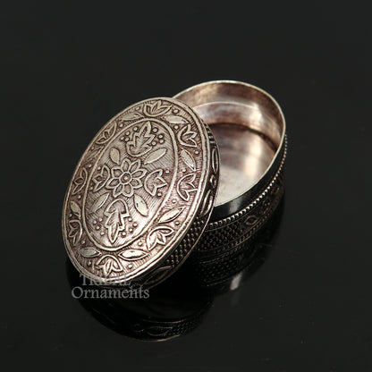 Small bridal kajal box made of 925 sterling silver by TRIBAL ORNAMENTS, featuring intricate tribal design for jewelry or trinkets.