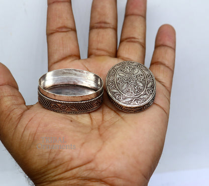 Small bridal kajal box in 925 sterling silver by TRIBAL ORNAMENTS, decorative jewelry or trinket container with intricate design.
