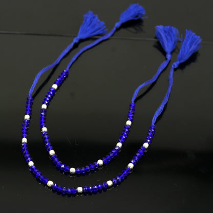Silver and semi-precious blue stone beaded anklet from Tribal Ornaments, custom-made modern jewelry with 925 silver beads and blue stones.