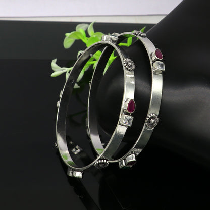 Sterling silver tribal bangles bracelet with green and red stones, handmade exclusive design by Tribal Ornaments.