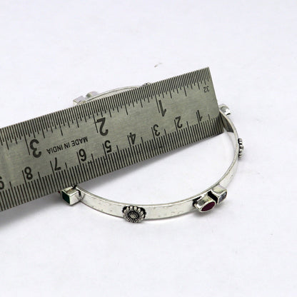 Sterling silver tribal bracelet with green and red stones, handmade design, stylish tribal jewelry from TRIBAL ORNAMENTS.