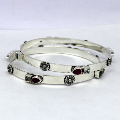Sterling silver tribal bangles bracelet with green and red stones, stylish handmade jewelry by Tribal Ornaments.