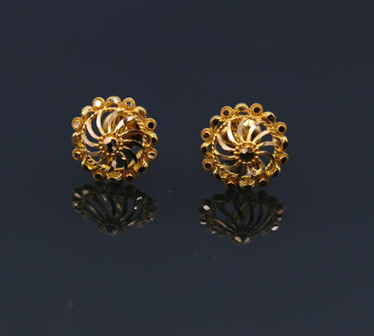 22Kt yellow gold handmade filigree stud earrings by TRIBAL ORNAMENTS, stylish Indian ethnic jewelry with intricate gold design.