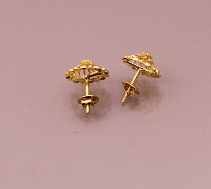 22Kt yellow gold handmade filigree stud earrings by Tribal Ornaments, stylish modern Indian solid gold jewelry with intricate design.