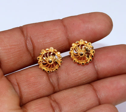 22Kt yellow gold handmade filigree stud earrings by TRIBAL ORNAMENTS, featuring intricate traditional Indian design in modern jewelry style.