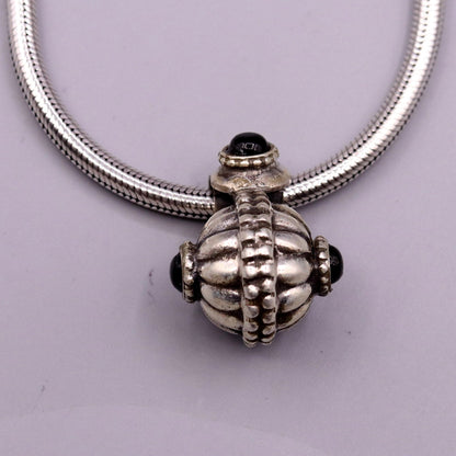 Sterling silver handmade vintage black stone pendant necklace featuring tribal design from India by TRIBAL ORNAMENTS.