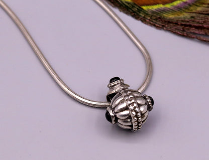 Handmade sterling silver vintage black stone pendant necklace with tribal design from India, showcasing intricate antique jewelry craftsmanship.