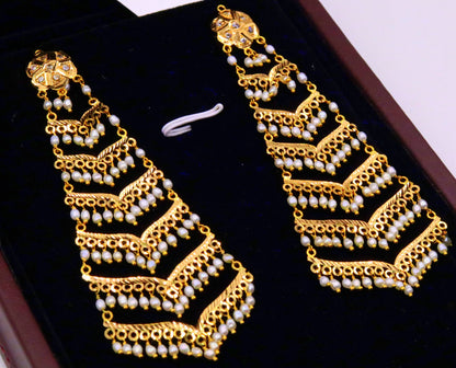 Handmade Indian bridal dangling earrings by TRIBAL ORNAMENTS with intricate chandelier design and dangling pearls for Punjabi Muslim women.