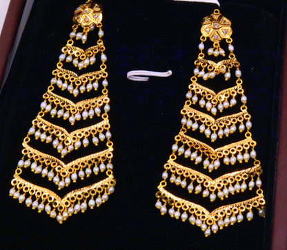 Handmade bridal dangling earrings by TRIBAL ORNAMENTS featuring Indian Bollywood style chandelier design with pearls for Muslim women.