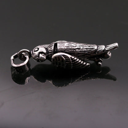 Sterling silver parrot-shaped pendant by TRIBAL ORNAMENTS, handmade unisex jewelry, lightweight and attractive gift accessory.
