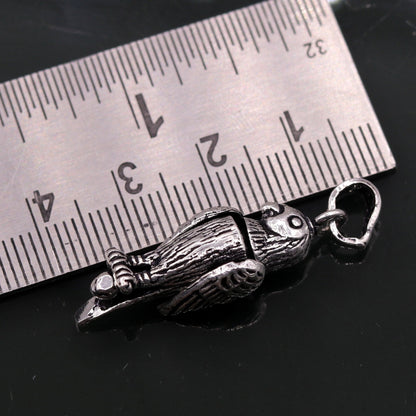 Sterling silver parrot-shaped pendant by Tribal Ornaments, unisex handmade jewelry, attractive small pendant for gifting or everyday wear.