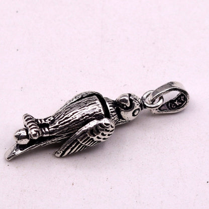 Sterling silver parrot-shaped pendant from TRIBAL ORNAMENTS, unisex jewelry with detailed handmade design, perfect for gifting.