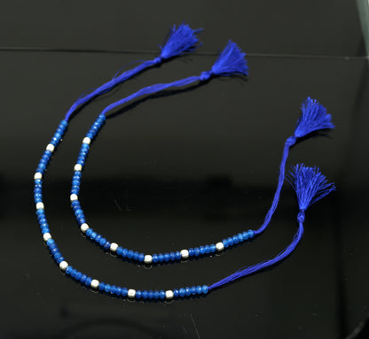 Fabulous Threads anklet by TRIBAL ORNAMENTS featuring semi-precious blue stones and 925 silver beads in a modern beaded design.