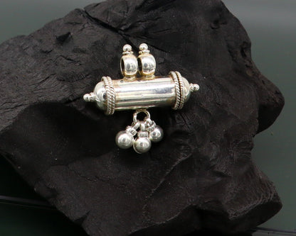 Fine 925 silver amulet pendant with a plain shine design, featuring jingling bells, elegant stylish jewelry by TRIBAL ORNAMENTS.