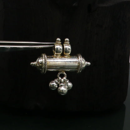 Silver amulet pendant with plain shine design, stylish jewelry featuring jingling bells, crafted by TRIBAL ORNAMENTS.