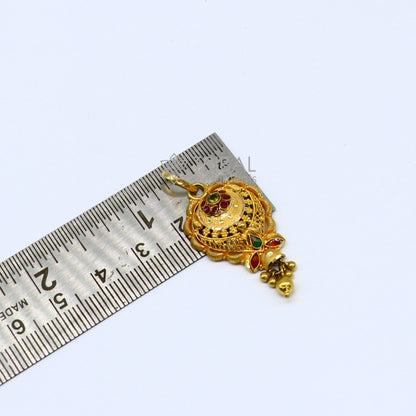 Traditional floral design 22KT yellow gold pendant by TRIBAL ORNAMENTS featuring intricate filigree work for ethnic bridal jewelry.