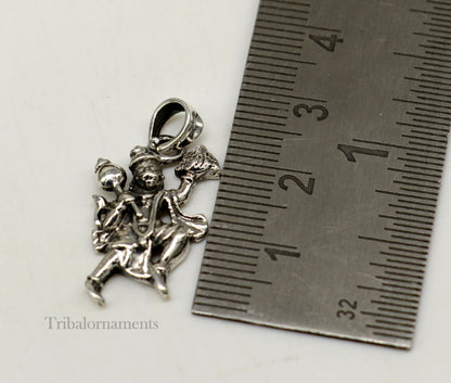 Sterling silver Flying Hanuman pendant by TRIBAL ORNAMENTS, handcrafted idol jewelry, detailed craftsmanship for gifting or personal wear.