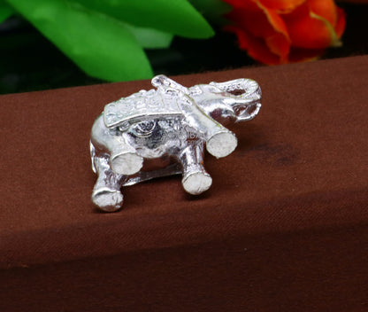 Solid 925 Sterling silver elephant sculpture by TRIBAL ORNAMENTS, detailed figurine representing wealth and prosperity.