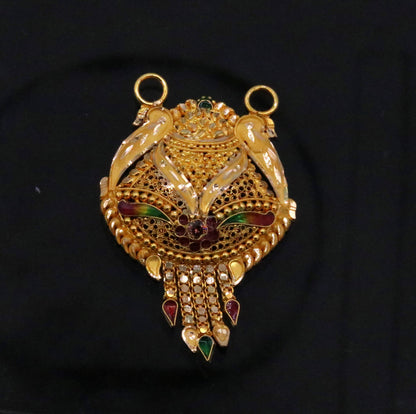 Genuine 22KT yellow gold pendant with intricate filigree and meenakari work, showcasing traditional Indian tribal jewelry craftsmanship.