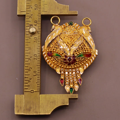 Genuine 22KT yellow gold tribal pendant with intricate filigree and meenakari work, traditional Indian tribal jewelry design.