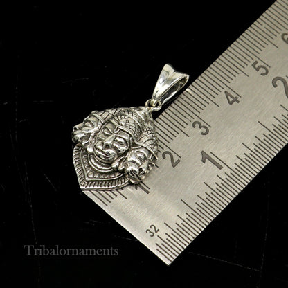 Sterling silver Hanuman pendant featuring three-faced idol, handmade tribal jewelry, perfect for gifting or religious wear.