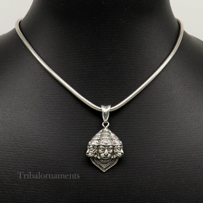 Sterling silver Hanuman pendant with three faces, handmade tribal jewelry featuring a detailed idol design.