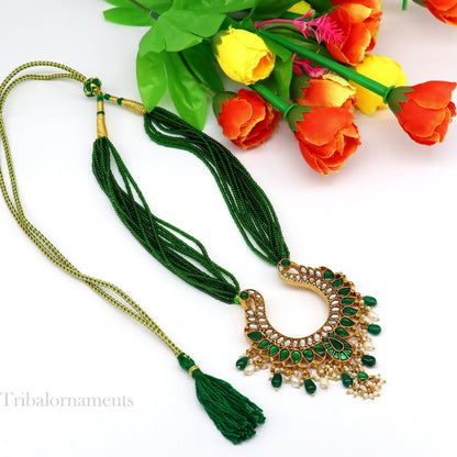 Gold polished sterling silver charm necklace with peacock pendant and hanging pearls, featuring intricate tribal-inspired design.