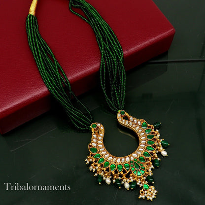 Gold polished sterling silver charm necklace featuring a peacock pendant with hanging pearls, tribal-inspired jewelry set.