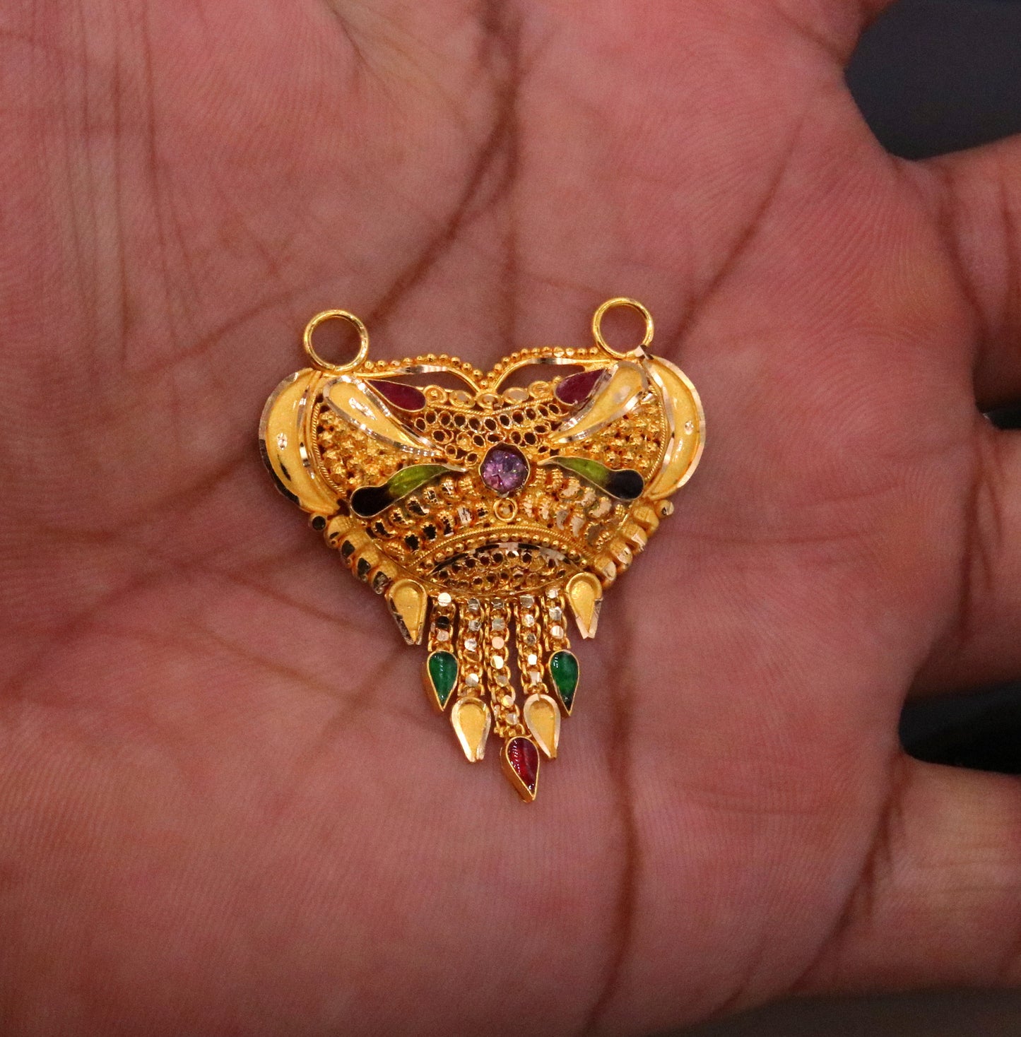 Handcrafted 22KT yellow gold filigree pendant from Tribal Ornaments, featuring traditional Indian tribal jewelry design and hallmarked solid gold.