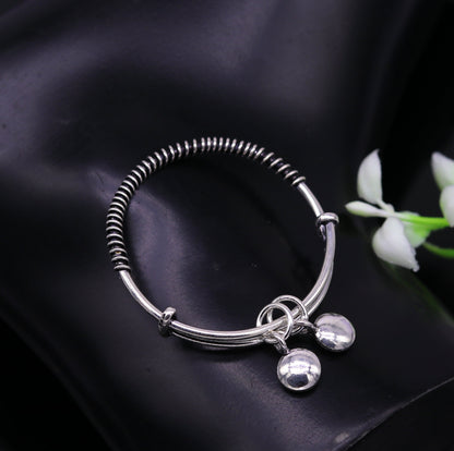 Handcrafted 925 sterling silver adjustable baby bangle bracelet with tribal-inspired charm, unisex kids jewelry by TRIBAL ORNAMENTS