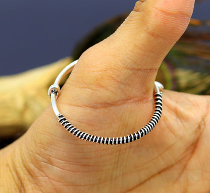 Handcrafted 925 sterling silver adjustable baby bangle bracelet with tribal charm, unisex kids jewelry by TRIBAL ORNAMENTS.
