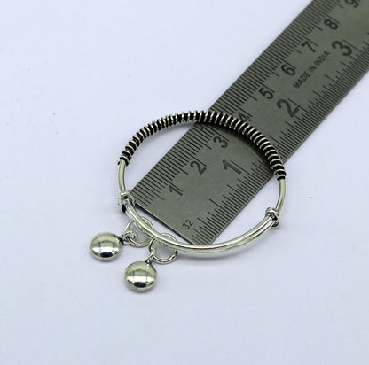 Handcrafted 925 sterling silver adjustable baby bangle bracelet with tribal design and charm, unisex kids jewelry by Tribal Ornaments