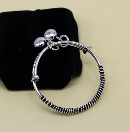 Handcrafted 925 sterling silver adjustable baby bangle bracelet with tribal design and charm, unisex kids jewelry by TRIBAL ORNAMENTS.